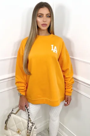 LA orange oversized back print sweater